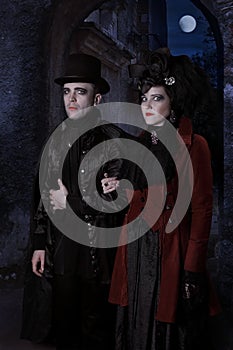 The sinister young couple dressed in vampire style clothes