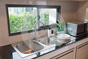sink with faucet in kitchen room