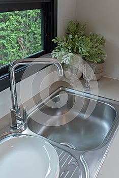 sink with faucet in kitchen room