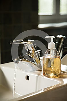 Sink with runnig water and liquid soap dispenser