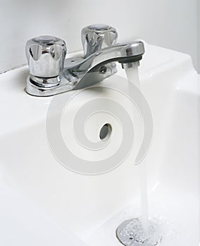 Sink with running water.