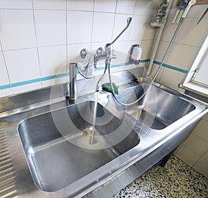 Sink stainless steel industrial kitchen with tap photo