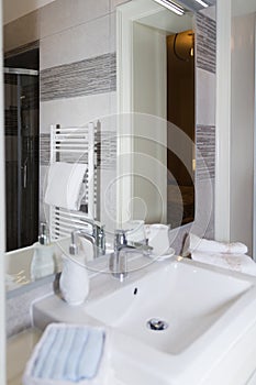 Sink, Tap, Towels and Bathroom Set. Modern Bathroom Interior Design