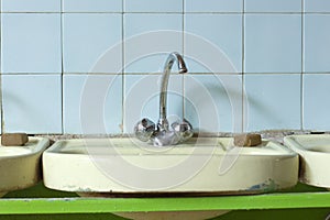 Sink with washbasin in a Russian school. Poverty and Poverty.