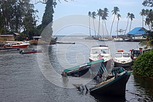 Sinked boat at wharf ocean view