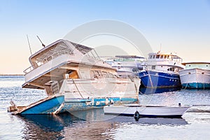 Sinking old wooden pleasure boat on sea