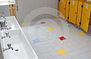 Sinks and washbasins with low taps in the toilets of a nursery
