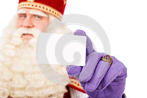 Sinterklaas with business card on white background