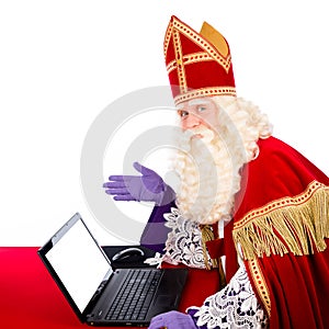 Sinterklaas with notebook or laptop