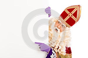 Sinterklaas pointing on placard