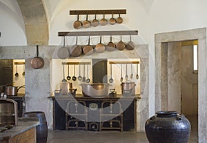 SINTRA, PALACE PENA, PORTUGAL - AUGUST 08, 2017 : Copper kitchen utensil on the kitchen of National Palace Pena, Portugal