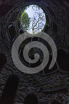 Sintra, Portugal, January 25, 2020: masonry initiatory well in the form of an inverted tower with slats coming out photo