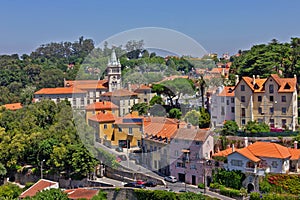 Sintra town houses with red roofs green street landscape, Portugal