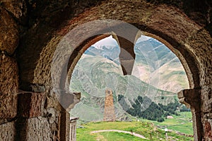 Sioni, Georgia. Ancient Old Stone Watchtower On Mountain Background In Sioni Village, Kazbegi District, Mtskheta