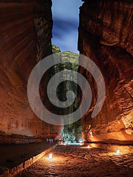 The Siq canyon in Petra during night walk, Jordan, Middle East