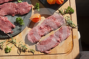 Sirloin on a cutting board, and a stoneplate