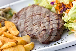 Sirloin steak with chips ,mushrooms,salad