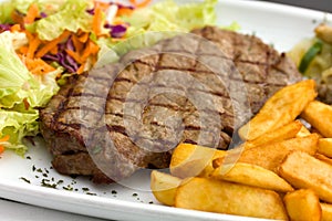 Sirloin steak with chips ,mushrooms,salad