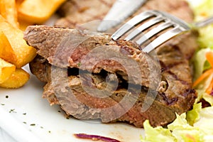 Sirloin steak with chips ,mushrooms,salad