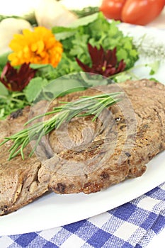 Sirloin steak with wild herb salad and rosemary