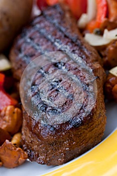 Sirloin strip steak with baked potato and chantere