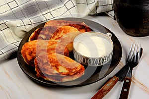 Sirniki or traditional russian pancakes from cottage cheese