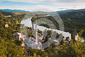 Sisman Ibrahim-immersed Mosque near forested areas and a river in Pocitelj, Bosnia and Herzegovina