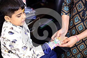 Sister binding rakhi on her brother`s hand at festival rakshabandhan