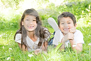 Sister and brother Adorable happy kids outdoors on summer day