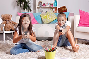 Sister and brother compete for watching TV photo