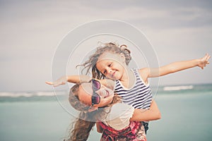 Sister and brother playing on the beach at the day time.