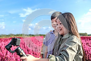 Sister and Brother are Recording their Travel Videos