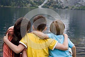 Sister And Brothers At Mountain Lake