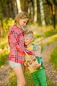 Sister calms a boy lost in the woods