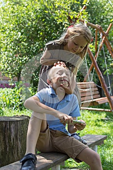 Girl loves her brother,sister embracing her brother outside