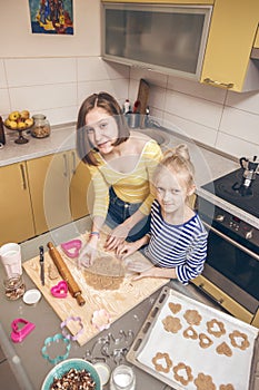 Sister girls cook in the kitchen