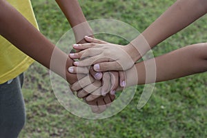 The sister held hands to encourage the brother.