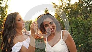 Sister takes out the hairpin from her sister`s hair