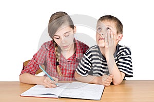 Sister Teaching Maths to Her Younger Disinterested Brother Isolated on White photo