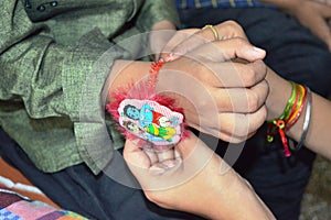 Sister ties Rakhi on brother's hand on Rakshabandhan Festival in India