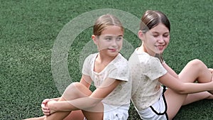 Sisterhood. Two sisters or friends spending time outdoors on sunny summer day. Bff, sibling, girlfriend. Millennial teen