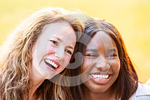 Sisterly Bond: Smiling Portrait of Multi-Ethnic Female Friends