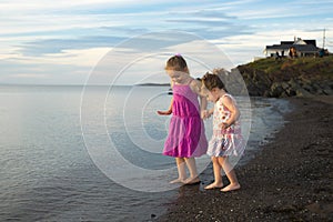 Sisters at the beach on sunset