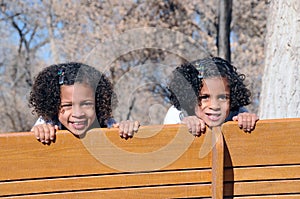 Sisters on bench swing