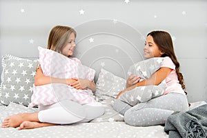 Sisters communication. Sisters communicate while relax in bedroom. Family time. Children relax and having fun in evening