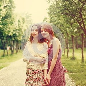 Sisters or Friends Outdoors in Summer Time