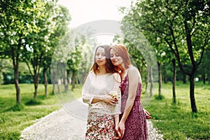 Sisters or Friends Outdoors in Summer Time