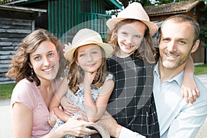 Sisters with hat and mother father family outdoors vacations