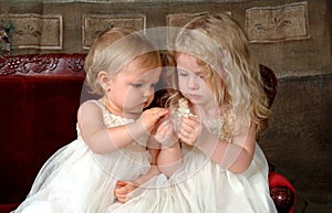 Sisters Holding Flower