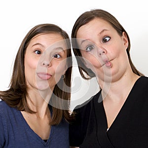 Sisters looking silly with puckered lips photo